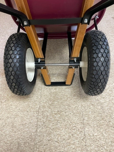 Two-wheel axle bracket assembly on a Scenic Road wheelbarrow showing bracket and wheel attachment