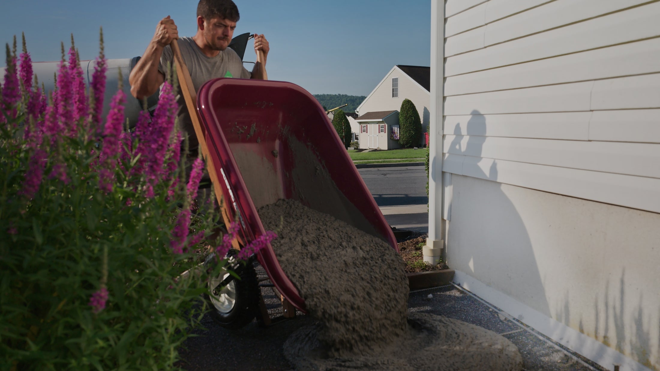 Pouring concrete from Scenic Road wheelbarrow
